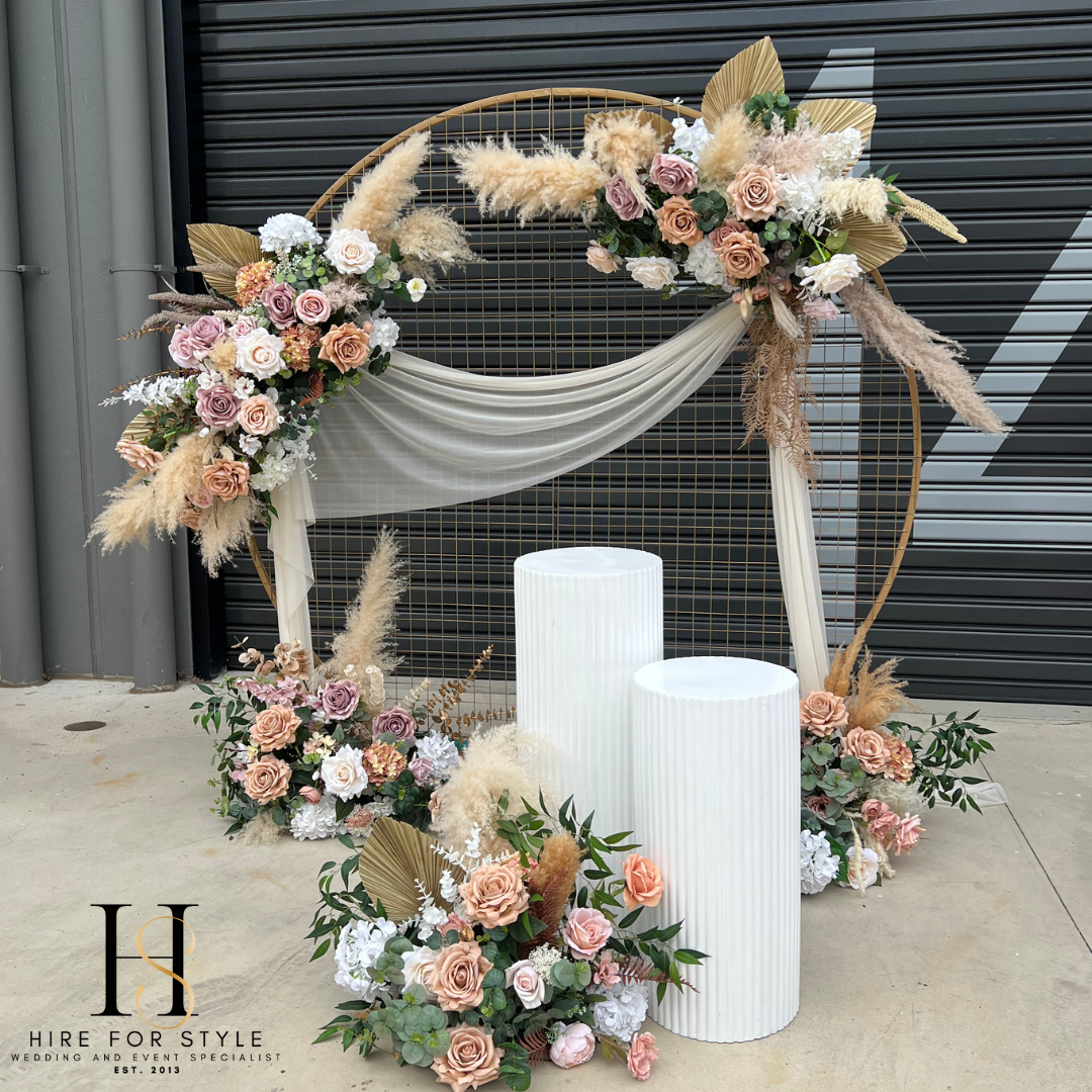 Gold Mesh Round Backdrop with Ripple Plinth and Florals