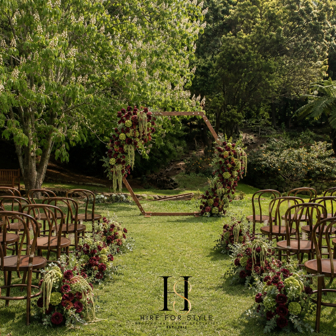 Hexagon Wedding Backdrop with Lush Florals and Bentwood Chairs